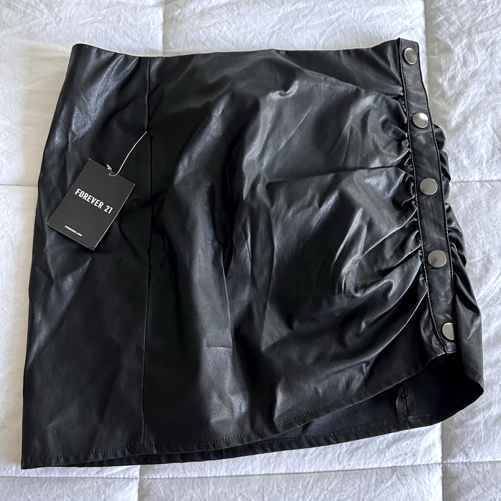 Forever 21 Vegan Leather mini skirt with buttons. NWT. Retail $22 .